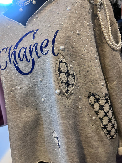 Distressed embellished sweatshirt