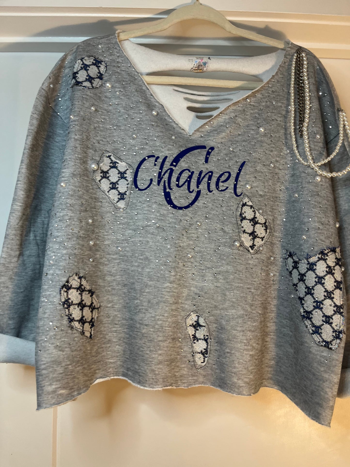 Distressed embellished sweatshirt