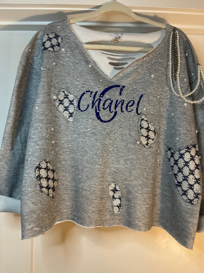 Distressed embellished sweatshirt