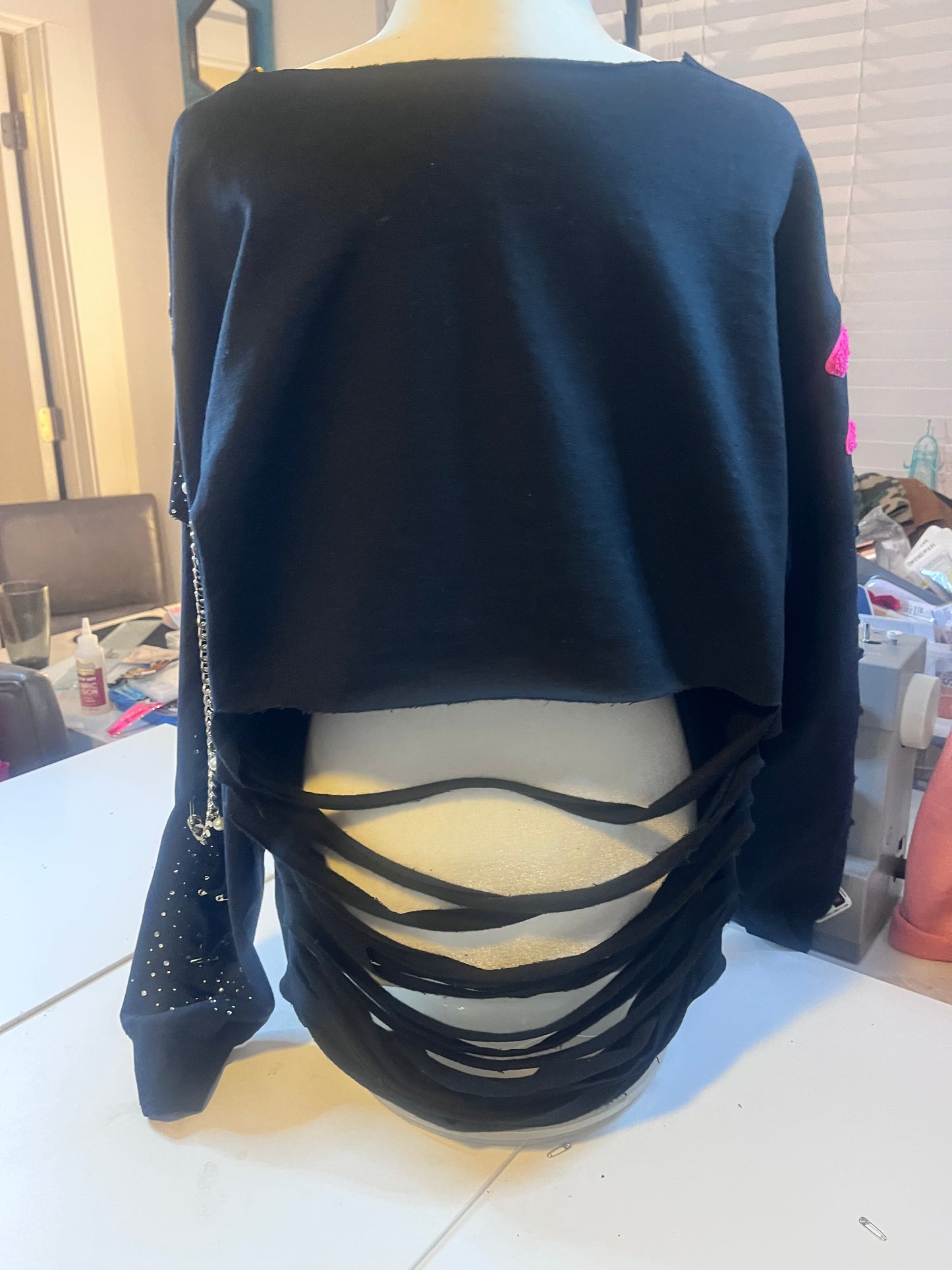 Distressed embellished sweatshirt