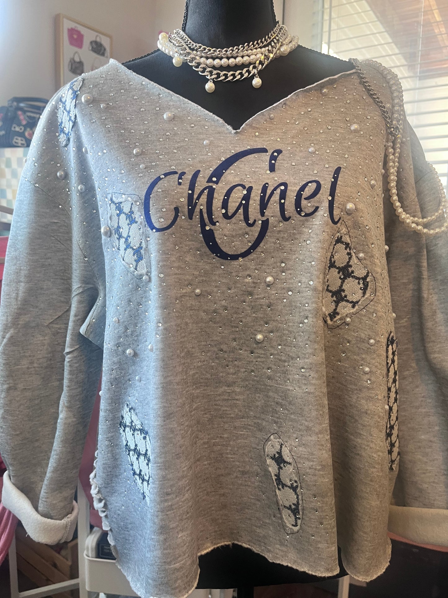 Distressed embellished sweatshirt