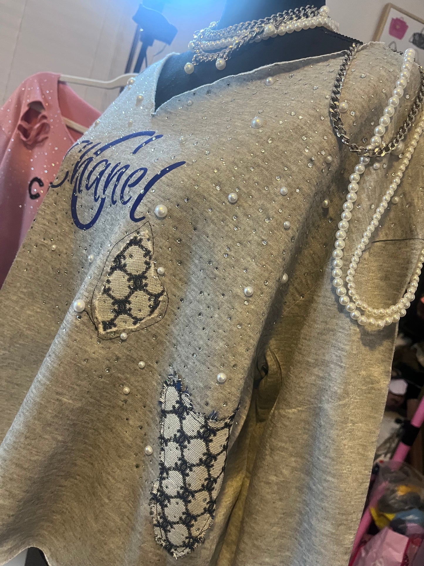 Distressed embellished sweatshirt