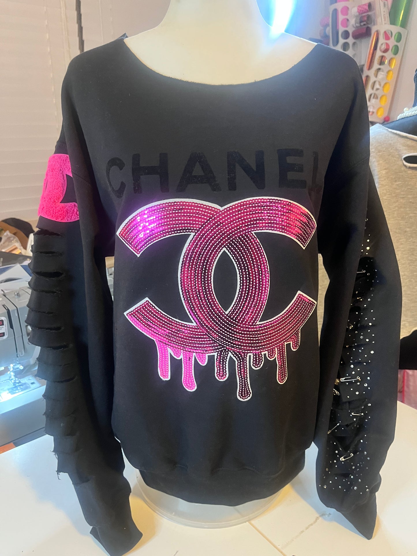 Distressed embellished sweatshirt